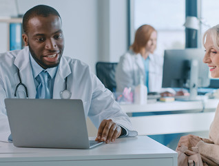 doctor discusses health history with patient