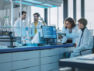 researchers evaluate clinical trial data in lab