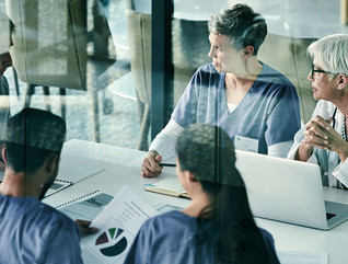 healthcare leaders meet and collaborate