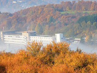 hospital located in foggy valley during fall