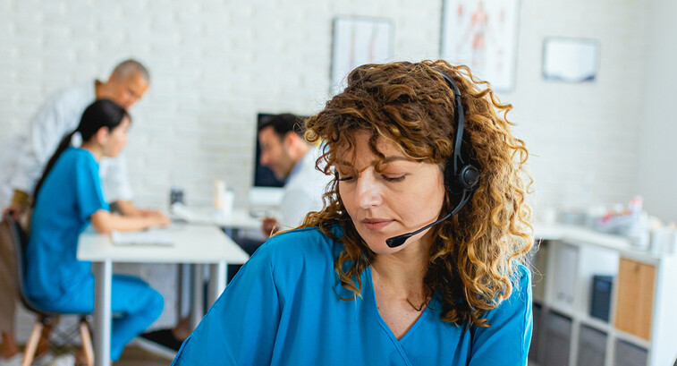 Nurse speaking to patient via phone